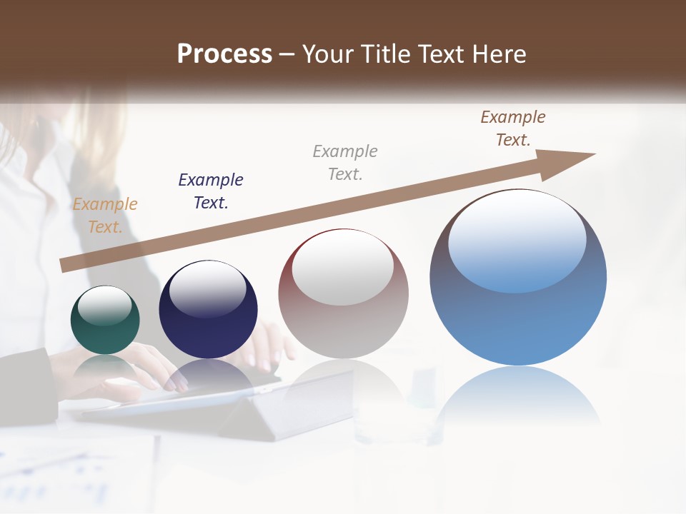 A Woman Sitting At A Table Using A Tablet Computer PowerPoint Template