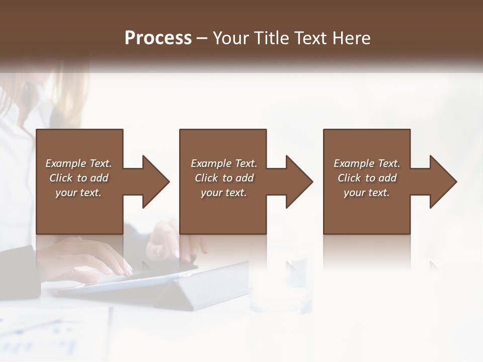 A Woman Sitting At A Table Using A Tablet Computer PowerPoint Template