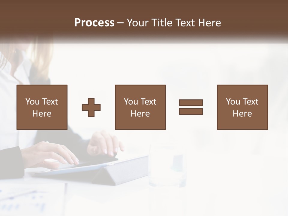 A Woman Sitting At A Table Using A Tablet Computer PowerPoint Template