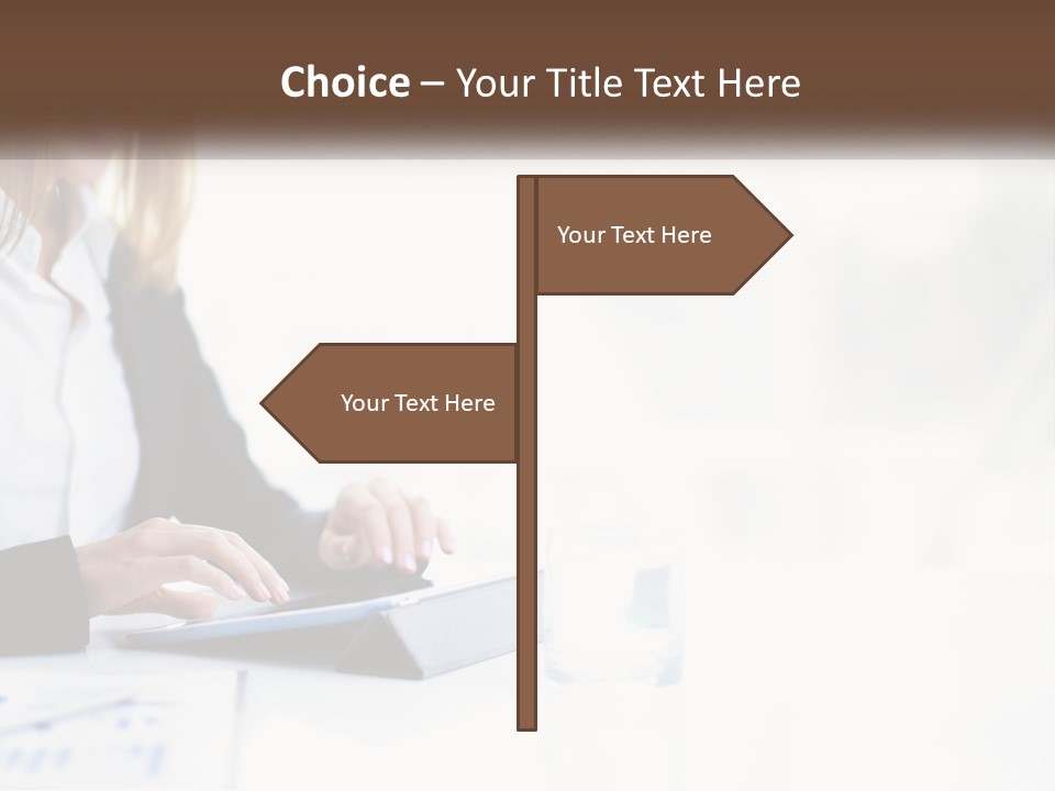 A Woman Sitting At A Table Using A Tablet Computer PowerPoint Template