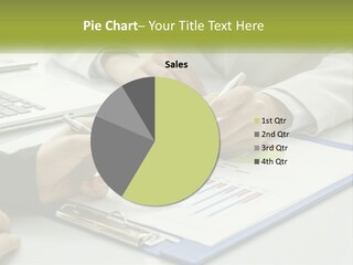 A Group Of People Sitting At A Table With Laptops PowerPoint Template