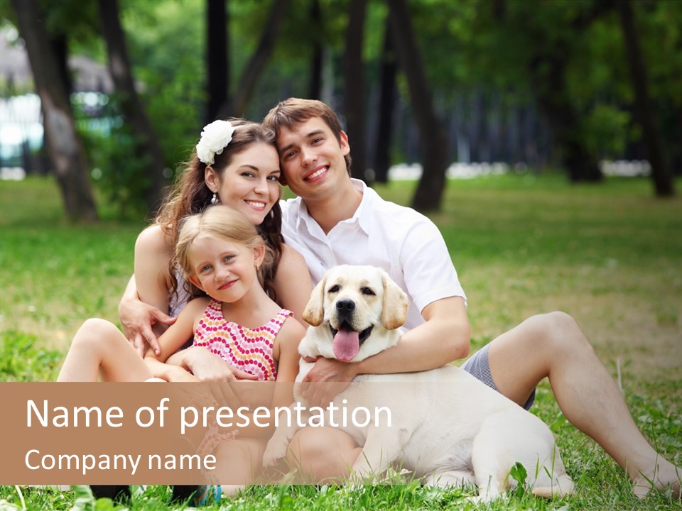 A Family Sitting In The Grass With A Dog PowerPoint Template