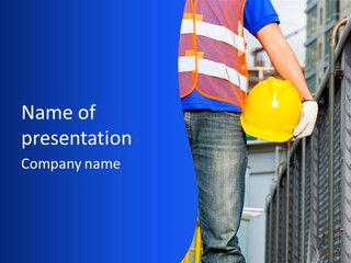 A Man In A Hard Hat Is Holding A Yellow Hard Hat PowerPoint Template