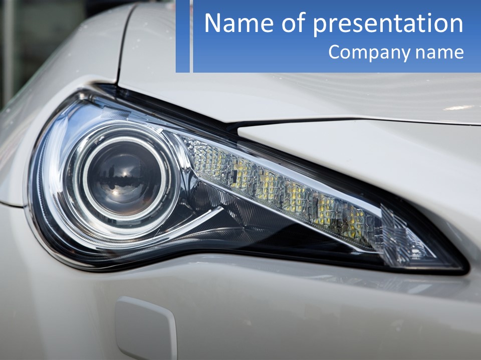 A Close Up Of A Car Headlight On A White Car PowerPoint Template