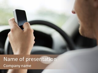 A Man Holding A Cell Phone While Driving A Car PowerPoint Template