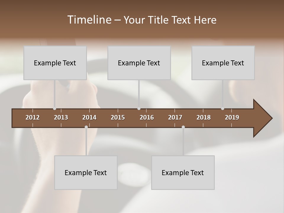A Man Holding A Cell Phone While Driving A Car PowerPoint Template