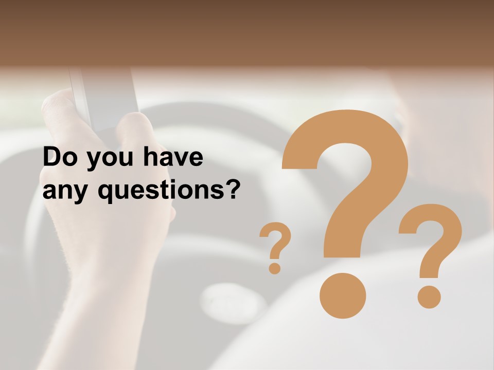 A Man Holding A Cell Phone While Driving A Car PowerPoint Template