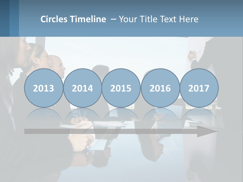 A Group Of Business People Sitting Around A Table PowerPoint Template