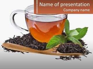 A Cup Of Tea Next To A Wooden Spoon PowerPoint Template
