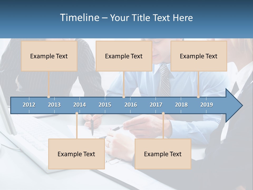 A Group Of People Sitting Around A Table With A Laptop PowerPoint Template