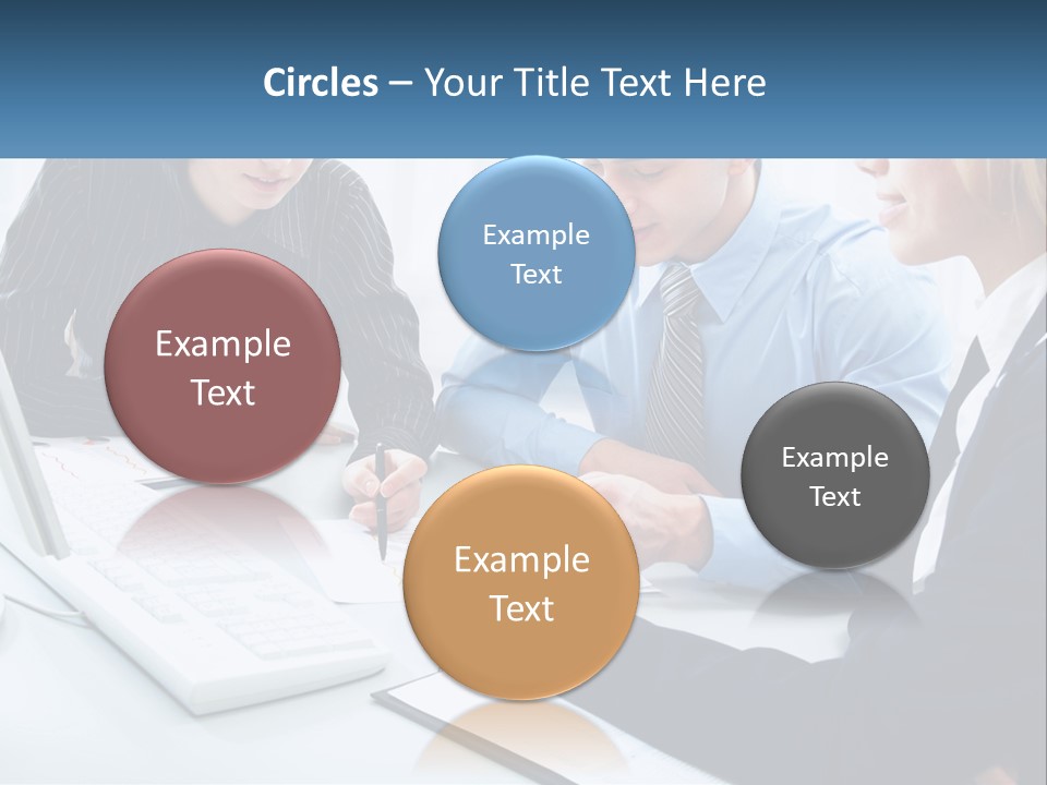 A Group Of People Sitting Around A Table With A Laptop PowerPoint Template