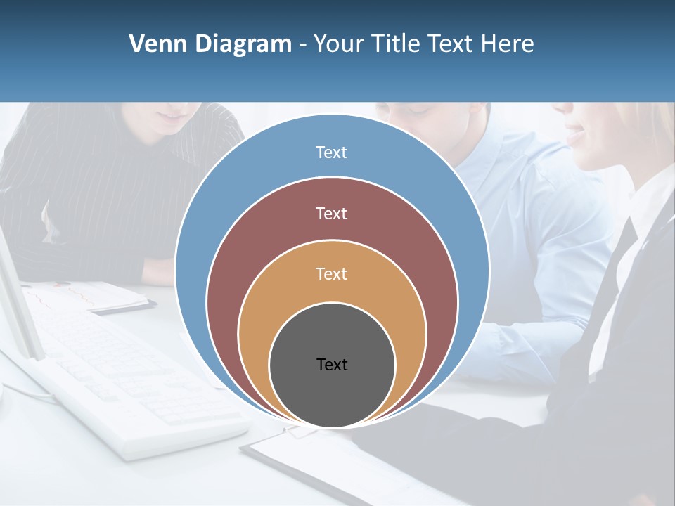 A Group Of People Sitting Around A Table With A Laptop PowerPoint Template