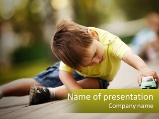 A Young Boy Playing With A Toy Truck PowerPoint Template
