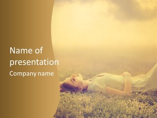 A Woman Laying On The Grass In A Field PowerPoint Template