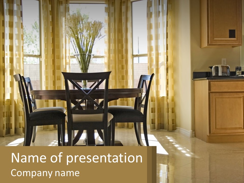 A Dining Room Table With Chairs And A Vase Of Flowers PowerPoint Template