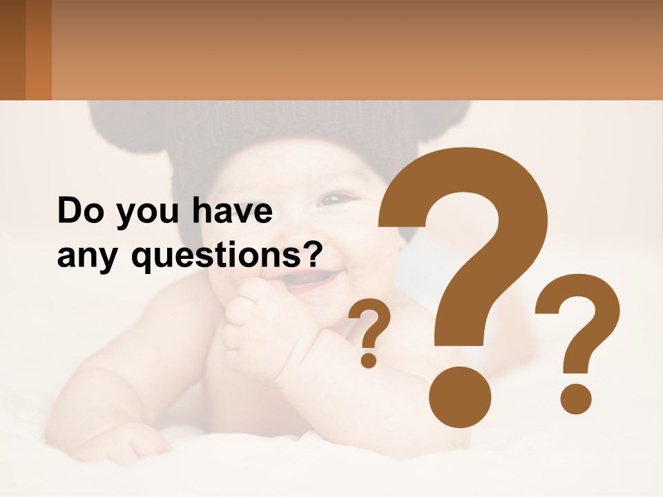 A Baby Wearing A Brown Hat Laying On Top Of A Bed PowerPoint Template