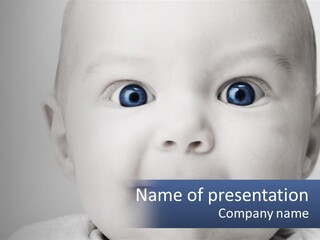 A Baby With Blue Eyes Is Looking At The Camera PowerPoint Template