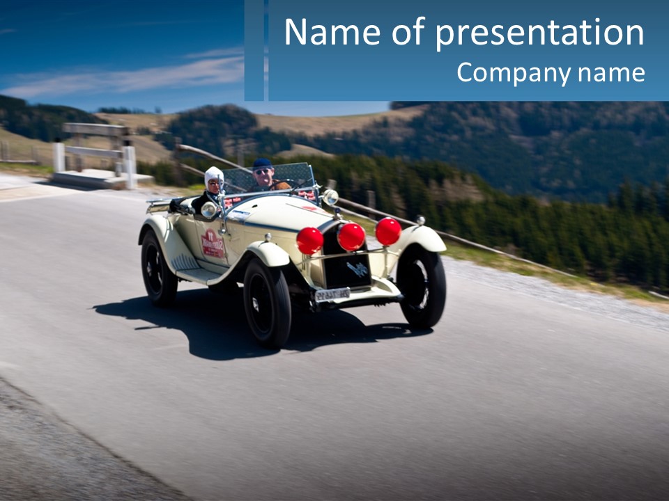 A Vintage Car Driving Down A Road With A Sky Background PowerPoint Template