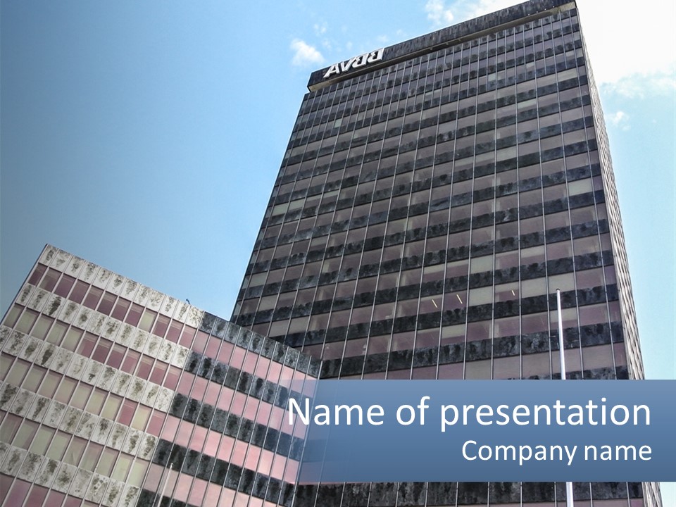 A Tall Building With A Blue Sky In The Background PowerPoint Template