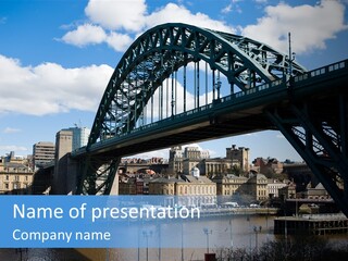 A Bridge Over A Body Of Water With Buildings In The Background PowerPoint Template