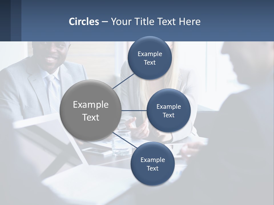 A Group Of People Sitting Around A Table PowerPoint Template