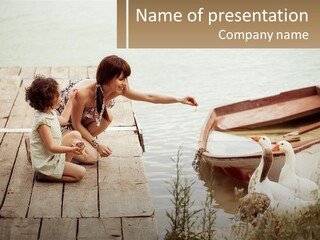 A Woman And A Child On A Dock Near A Boat PowerPoint Template