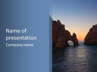 A Large Body Of Water With Rocks In The Background PowerPoint Template