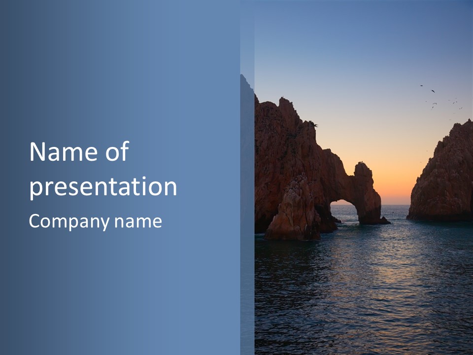 A Large Body Of Water With Rocks In The Background PowerPoint Template