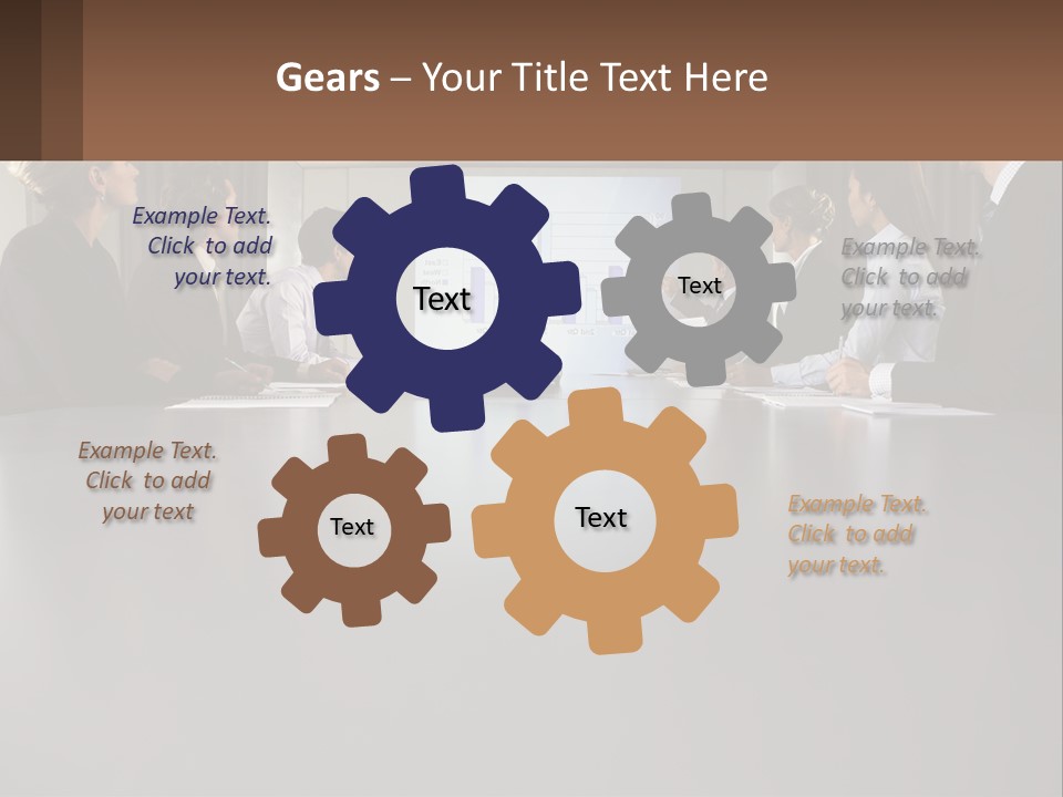 A Group Of People Sitting Around A Conference Table PowerPoint Template