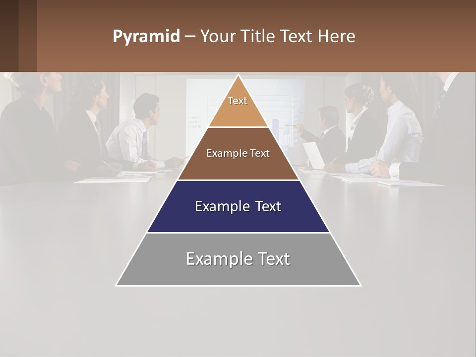 A Group Of People Sitting Around A Conference Table PowerPoint Template