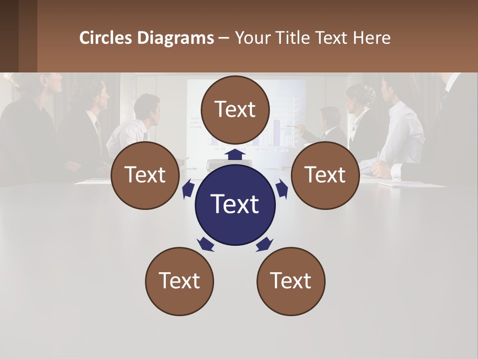 A Group Of People Sitting Around A Conference Table PowerPoint Template