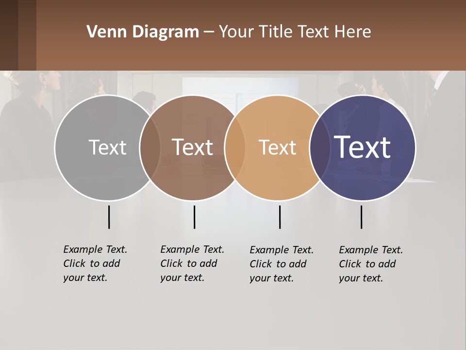 A Group Of People Sitting Around A Conference Table PowerPoint Template