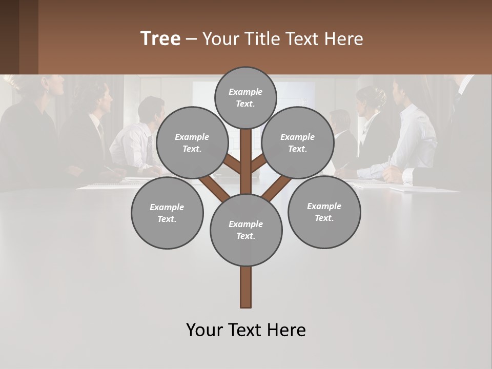 A Group Of People Sitting Around A Conference Table PowerPoint Template
