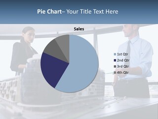 A Group Of People Standing Around A Model Of A Building PowerPoint Template