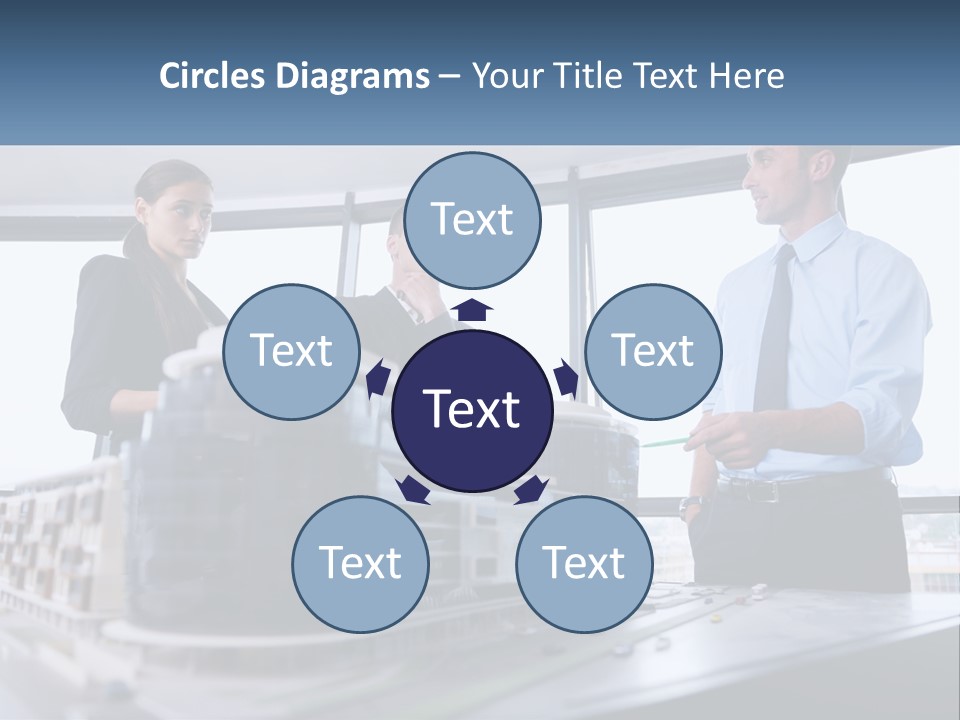 A Group Of People Standing Around A Model Of A Building PowerPoint Template