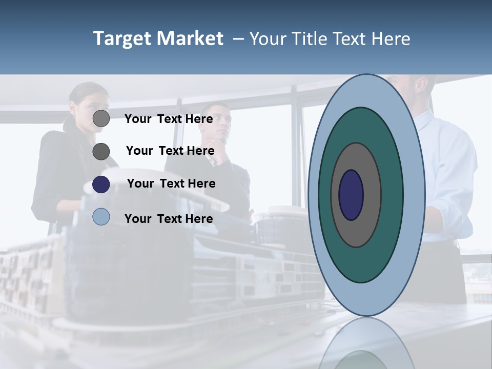 A Group Of People Standing Around A Model Of A Building PowerPoint Template