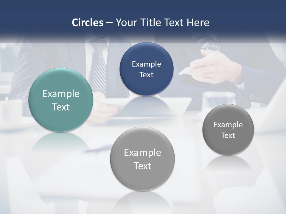 Two Men Sitting At A Table Looking At A Tablet PowerPoint Template