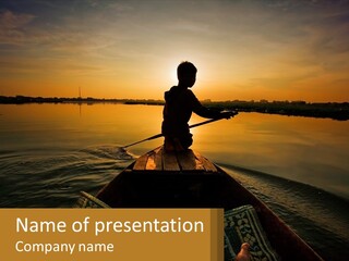 A Person Rowing A Boat On A Body Of Water PowerPoint Template