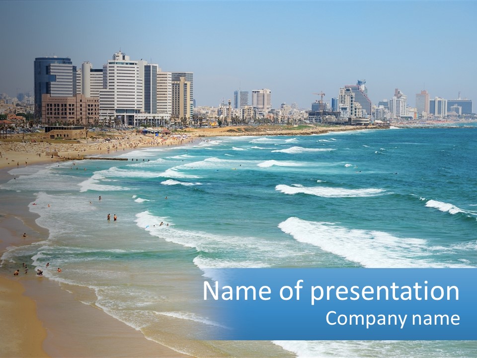 A Beach With A City In The Background PowerPoint Template