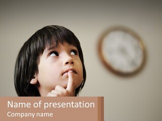 A Young Boy Looking Up At A Clock PowerPoint Template