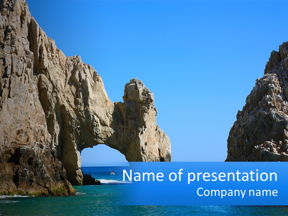 A Large Rock Formation In The Middle Of The Ocean PowerPoint Template