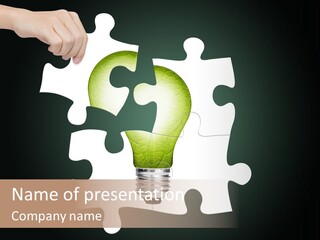 A Person Holding A Piece Of Puzzle With A Light Bulb PowerPoint Template