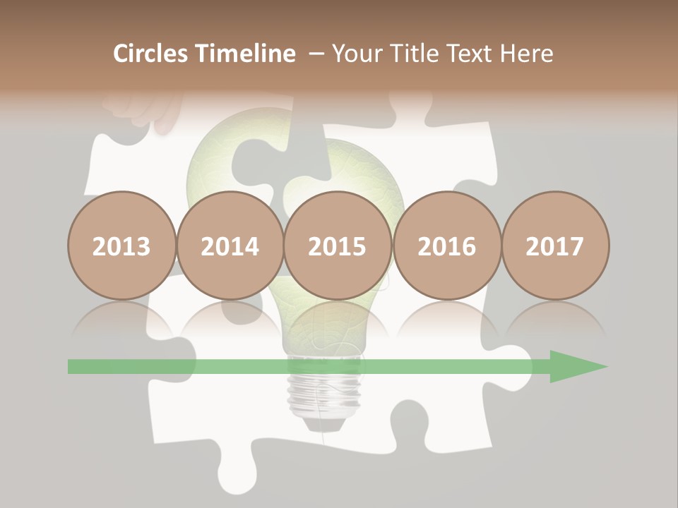 A Person Holding A Piece Of Puzzle With A Light Bulb PowerPoint Template