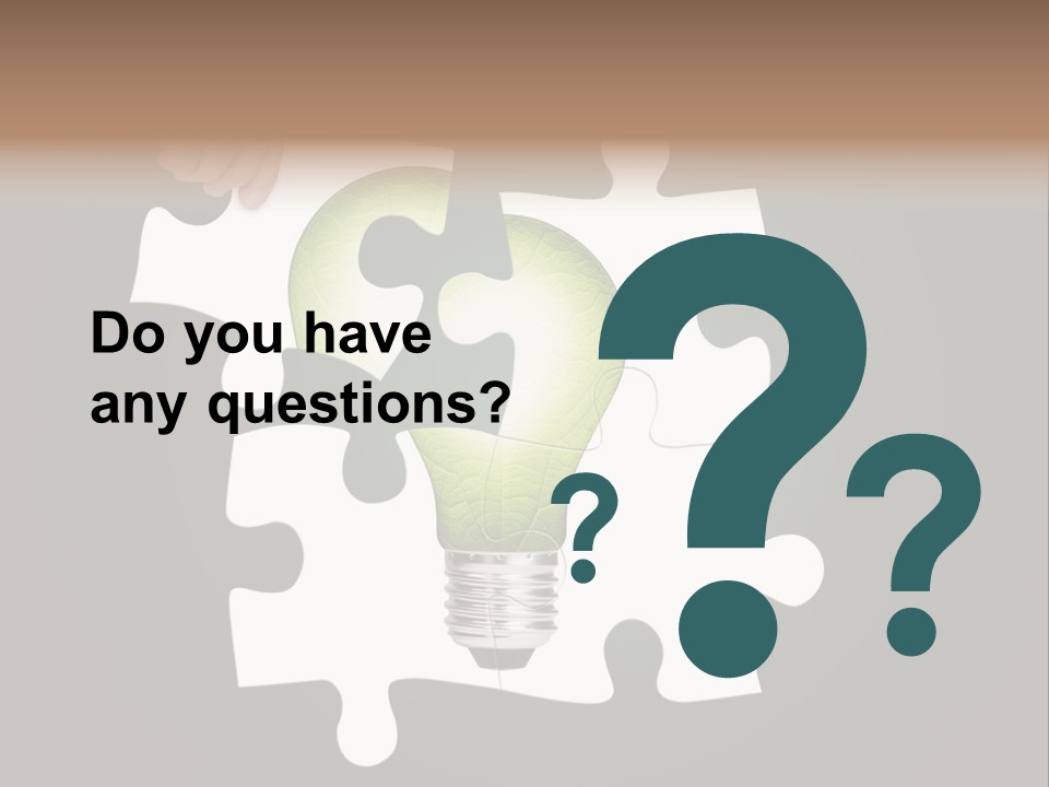 A Person Holding A Piece Of Puzzle With A Light Bulb PowerPoint Template