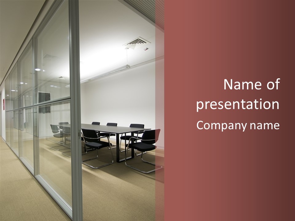 A Conference Room With A Table And Chairs PowerPoint Template