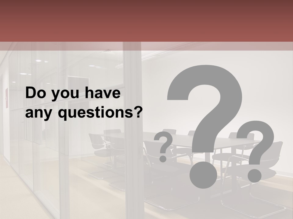 A Conference Room With A Table And Chairs PowerPoint Template