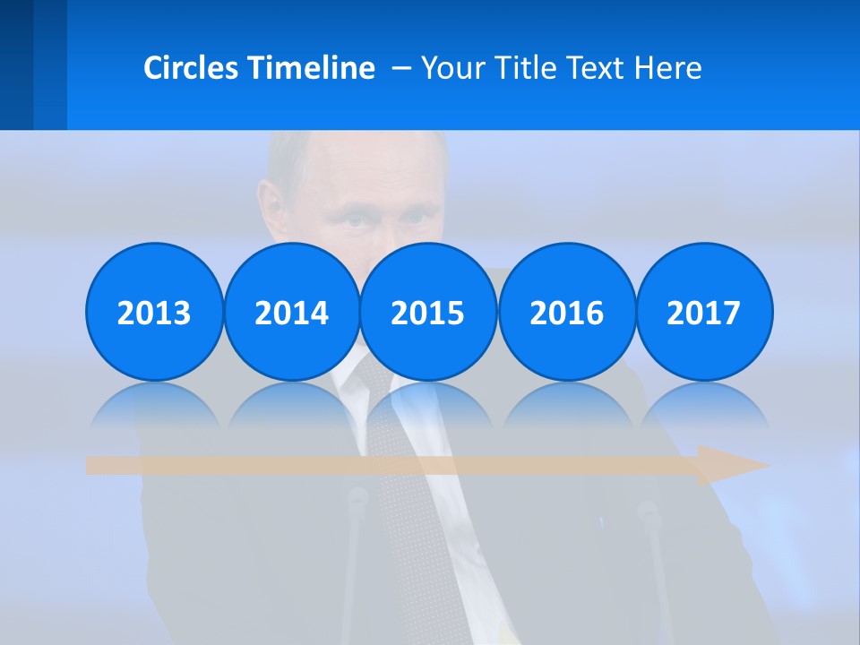 A Man In A Suit And Tie Sitting At A Table PowerPoint Template