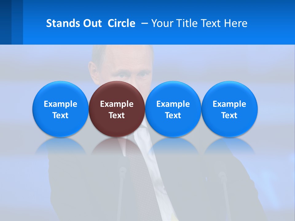 A Man In A Suit And Tie Sitting At A Table PowerPoint Template