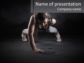 A Woman Doing Push Ups In The Dark PowerPoint Template