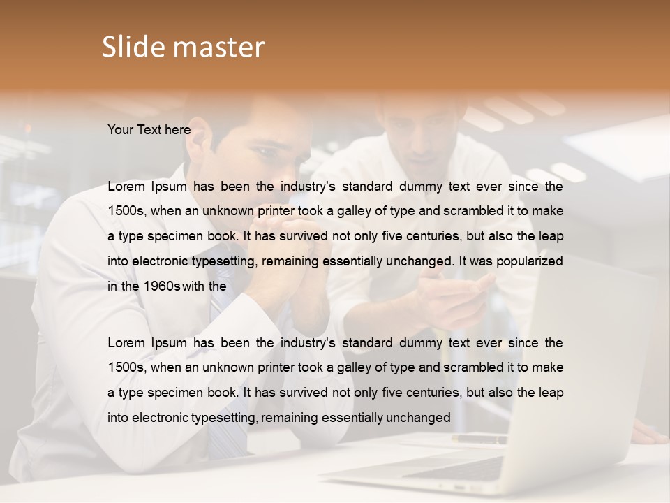 Two Men Sitting At A Table Looking At A Laptop PowerPoint Template